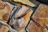 tiger eye bracelet hanging on stone 